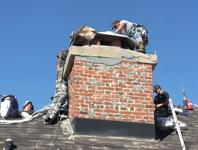 Yucaipa Chimney Sweep installing a custom chimney crown in Yucaipa, CA