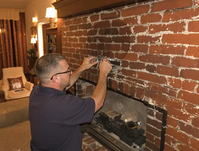 Yucaipa Chimney Sweep expert fixing a fireplace in Yucaipa, CA